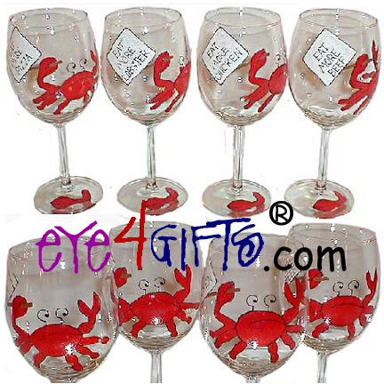 A set of four 10 ounce wine glasses. There is a large red crab painted on 